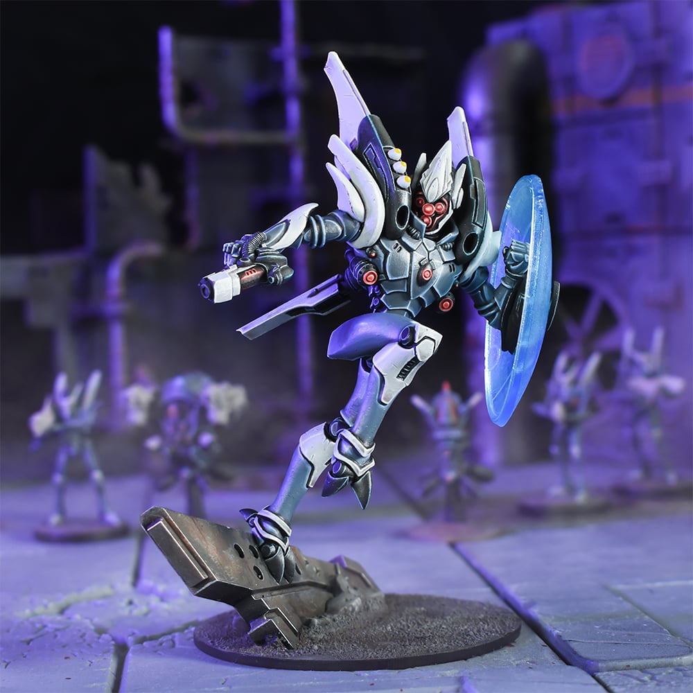 A gray and white sci-fi robot miniature leaps with a gun and glowing blue shield on a ruined base in purple light