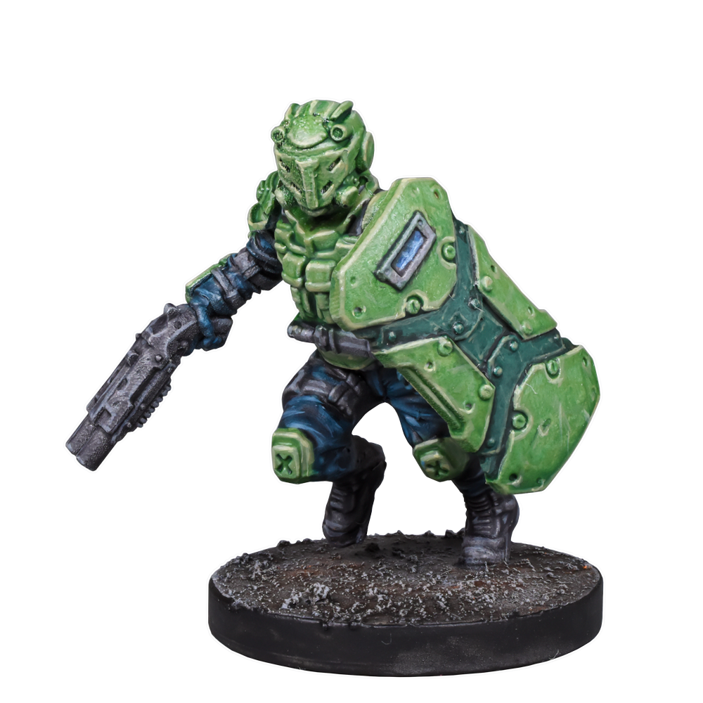 A miniature sci-fi soldier in green armor, wielding a shield and rifle, in a crouched pose