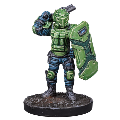 Green armored miniature soldier with a helmet, holding a large shield and weapon, standing on a base