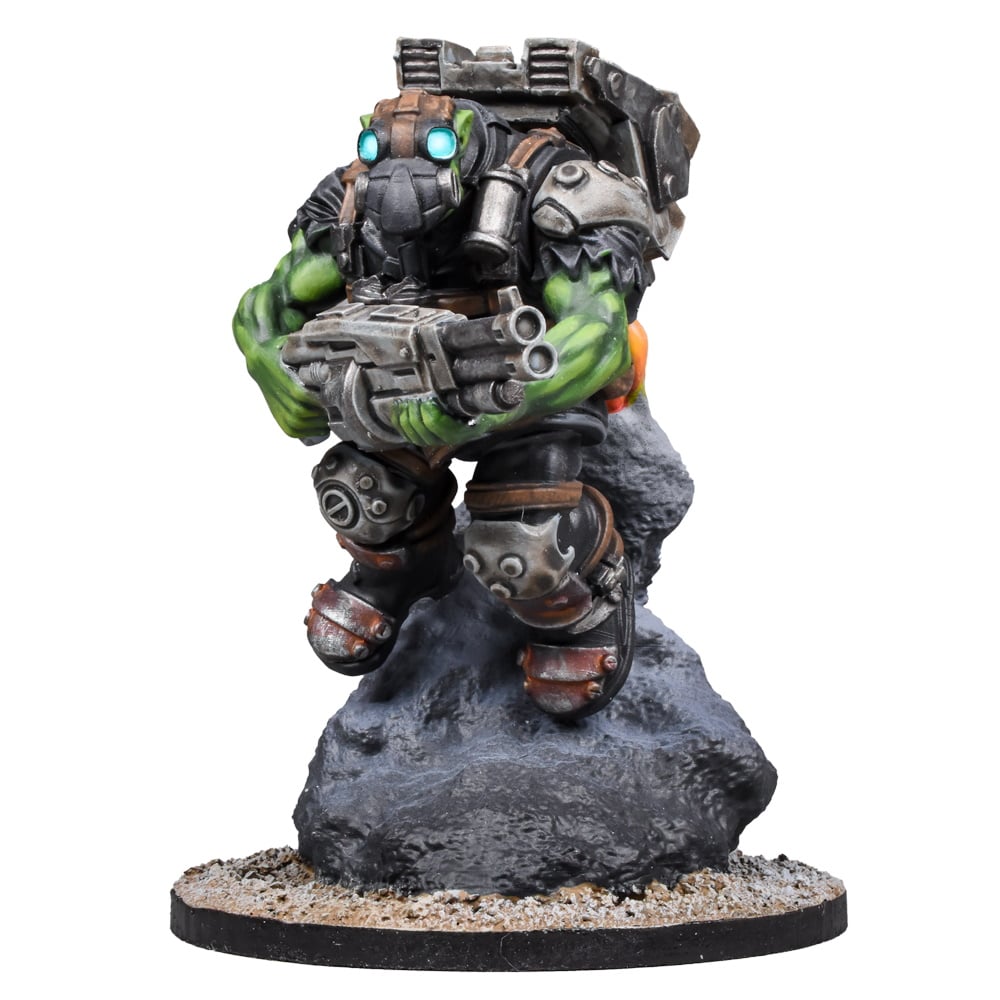 Miniature of an armored green orc with a gas mask, glowing eyes, holding a large gun