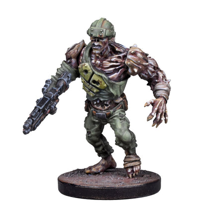 A miniature of a decaying, mutated soldier in a green uniform and helmet, holding a rifle