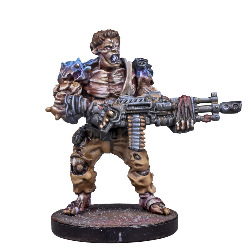 A detailed miniature of a hulking, mutated zombie with red eyes, snarling and holding a heavy machine gun