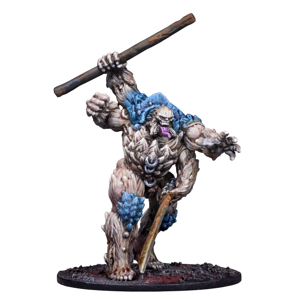 A fantasy miniature of a beige, rock-like monster with blue growths, wielding a large club in an aggressive pose