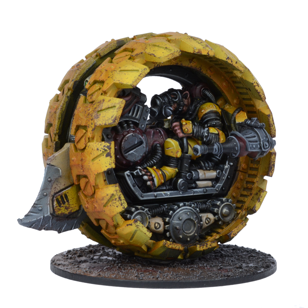 A yellow, weathered monowheel vehicle with a gas-masked pilot inside and a front blade