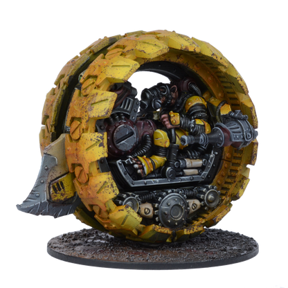 A yellow, weathered monowheel vehicle with a gas-masked pilot inside and a front blade