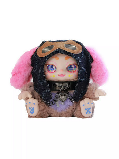 Furry art toy in a denim aviator hood with pink ears and a heart locket choker