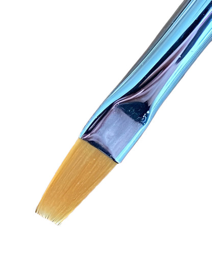 Close-up of a flat-tipped makeup or nail art brush with tan bristles and a shiny iridescent blue handle