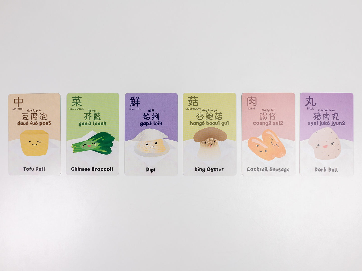 Six multilingual flashcards depicting cute, cartoon-style food ingredients: Tofu Puff, Broccoli, and Pork Ball