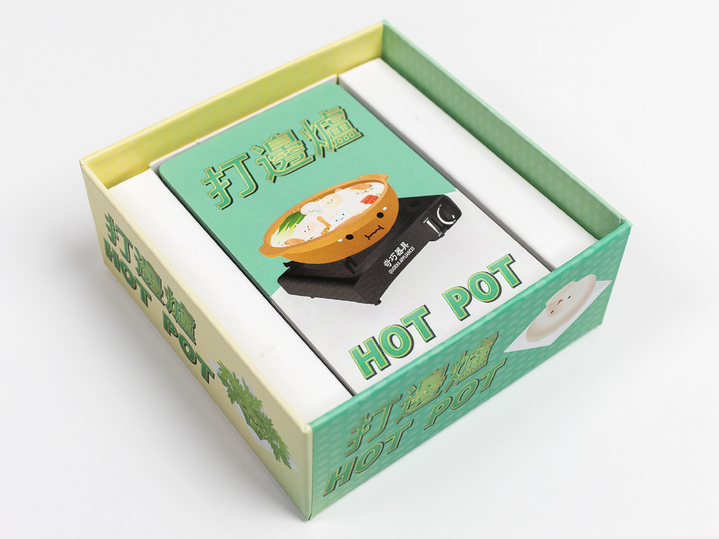 Open box of a hot pot themed card game. The cover shows a cartoon hot pot bowl on a stove, labeled "HOT POT"
