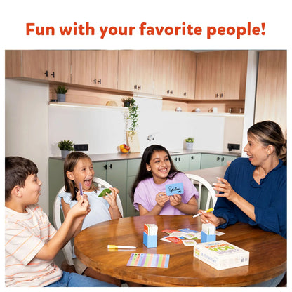 Four people laughing and holding cards while playing a tabletop game together