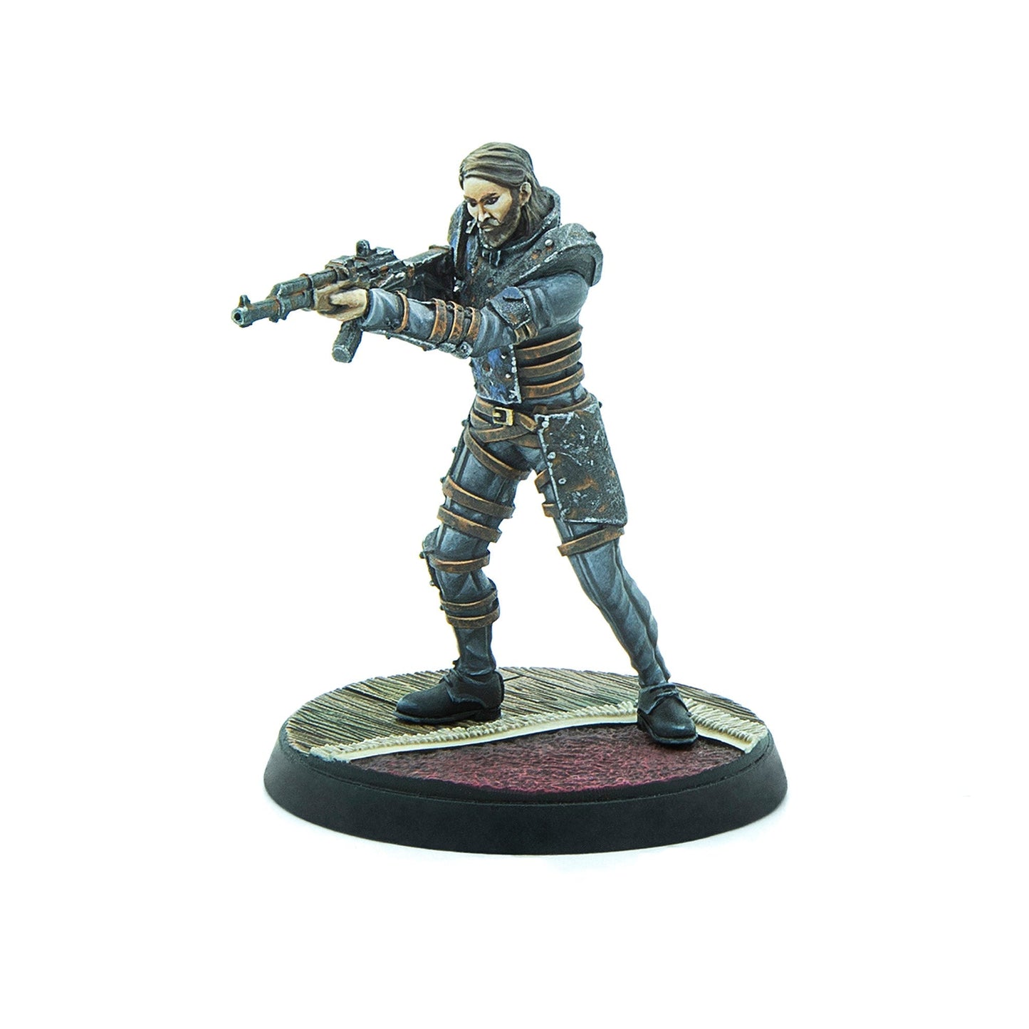 Painted miniature of a bearded man in dark, tactical clothing, aiming a rifle forward