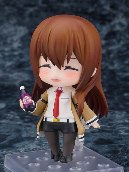 Nendoroid Kurisu Makise figure holding a Dr Pepper bottle wearing her brown coat and black shorts