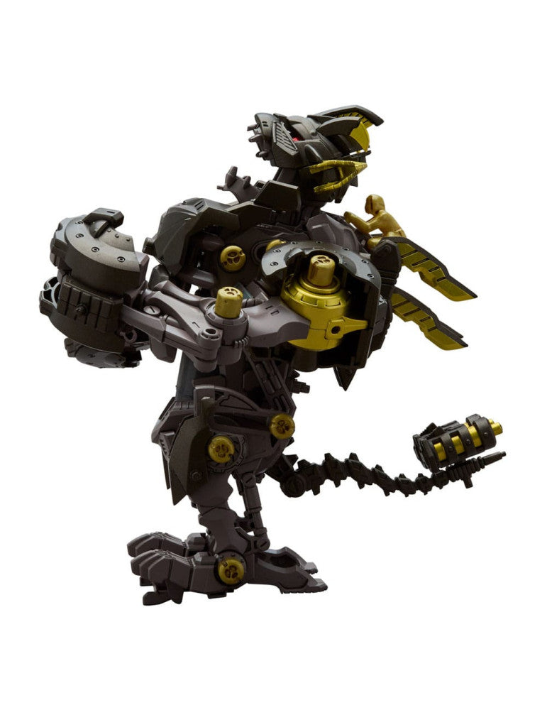 Dark grey and gold mechanical dinosaur toy with a tiny golden pilot figure on its back, standing on white
