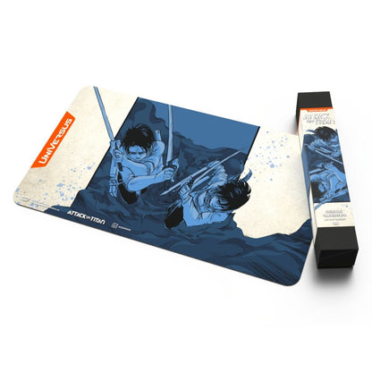 Attack on Titan playmat featuring two characters in combat poses wielding swords, beside a tall matching product box