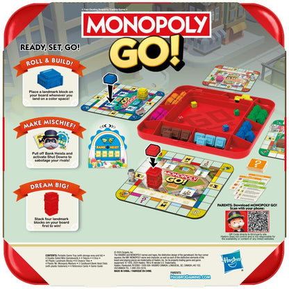 Monopoly GO! game set is displayed, featuring a red tray with colorful game pieces and blocks, three mini game boards, and descriptive text bubbles