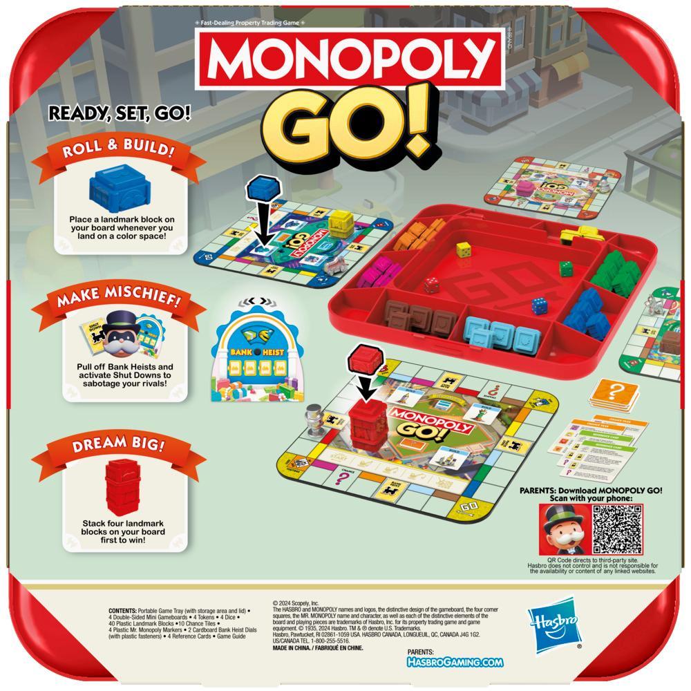 Monopoly GO! game set is displayed, featuring a red tray with colorful game pieces and blocks, three mini game boards, and descriptive text bubbles