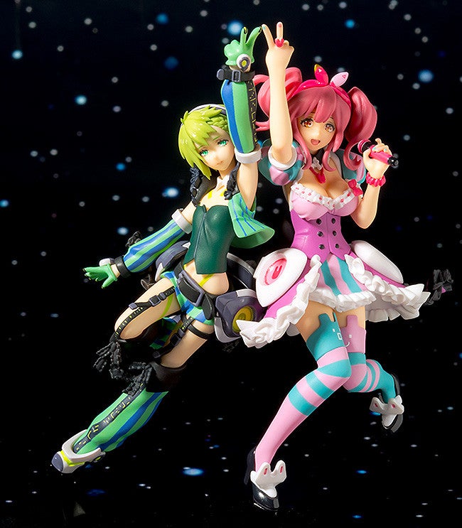 Two anime figures one in green and black the other in pink and blue standing and posing against a starry background