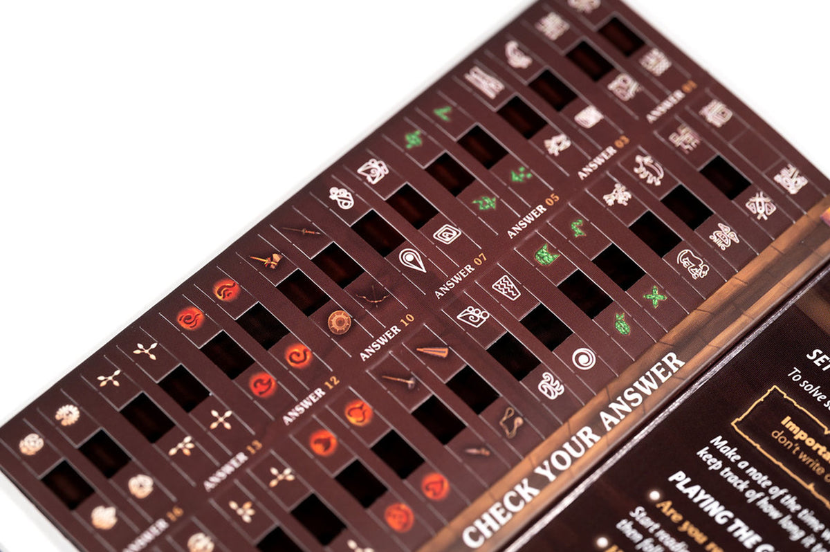 Detailed view of illustrated game sheets from Unfold: Victim of the Pyramid showing symbols, characters, and ancient Egyptian-style puzzles