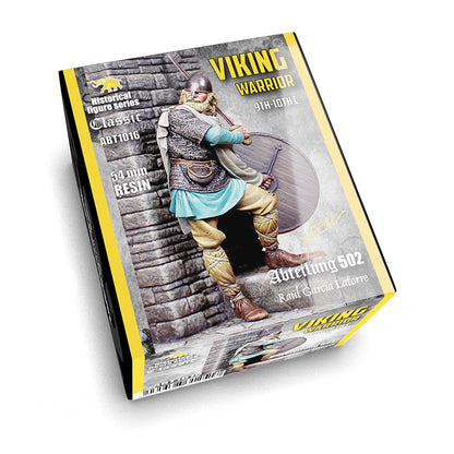 Box for a Viking Warrior 9th-10th C figure, showing a warrior in a helmet, chainmail, sword, and shield against a stone wall