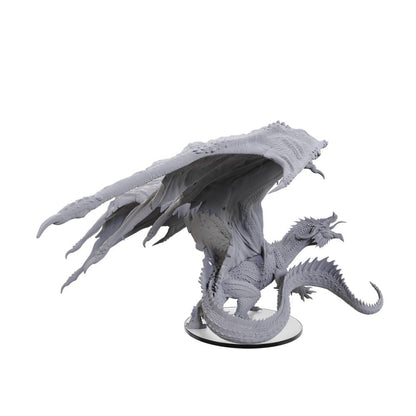 Detailed unpainted resin dragon miniature with large spread wings on a clear base