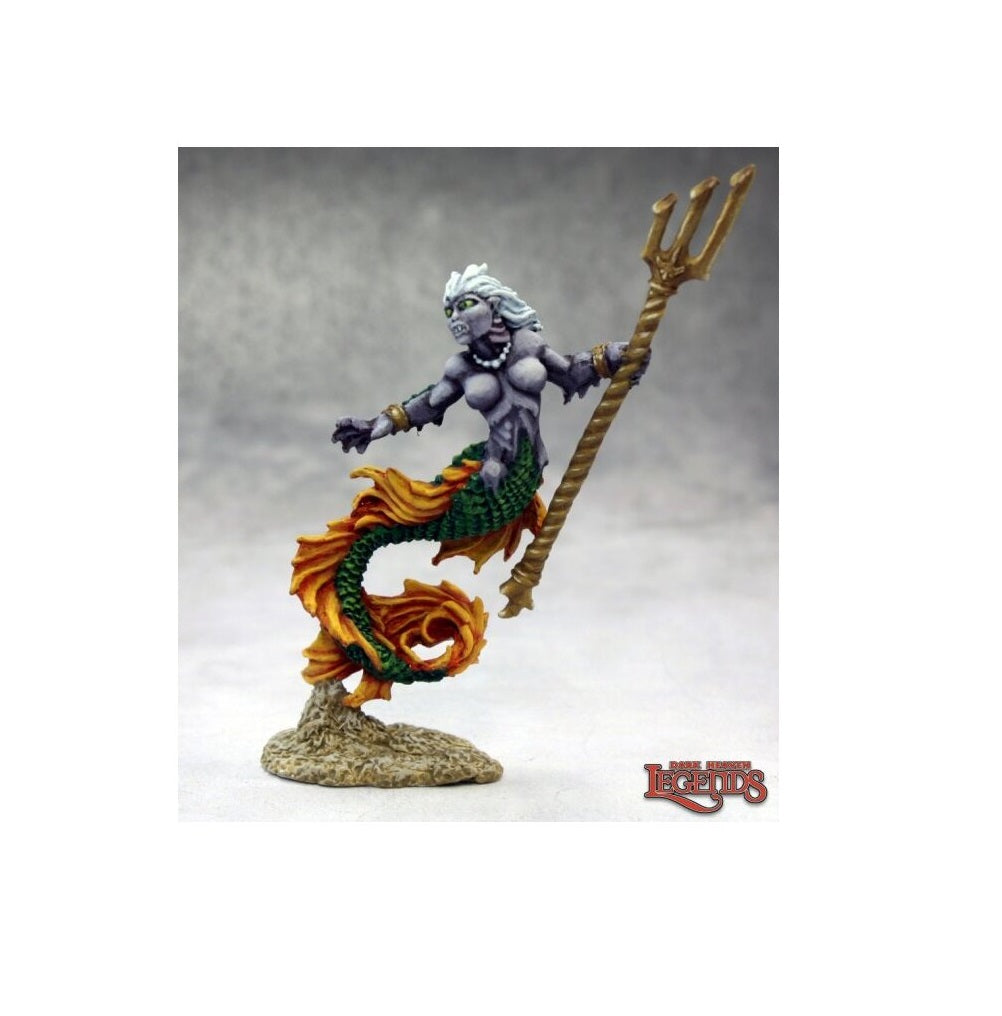 Painted miniature of a monstrous gray-skinned mermaid holding a golden trident