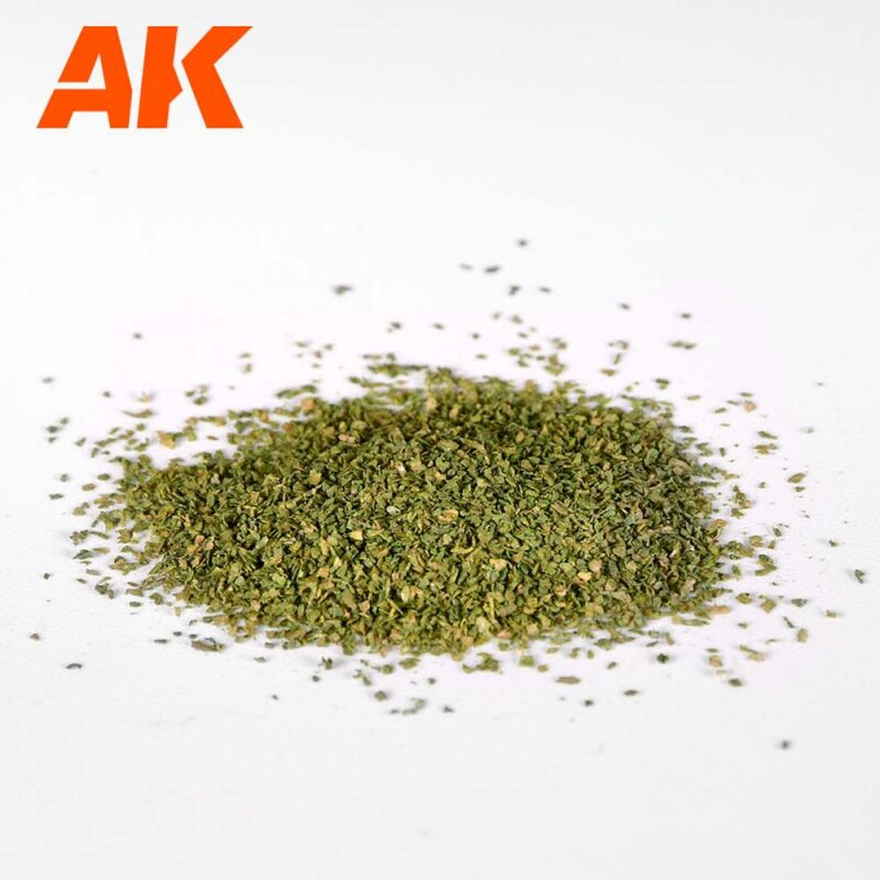 Pile of fine green model scenery flock with orange AK logo