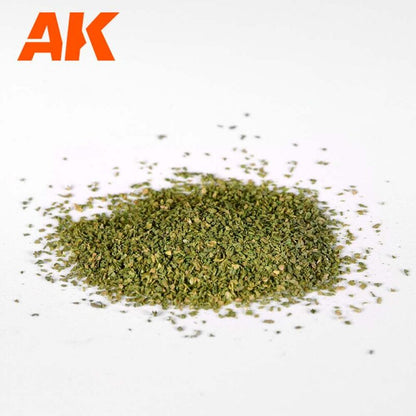 Pile of fine green model scenery flock with orange AK logo