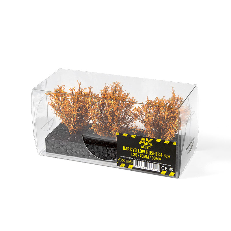 Three dark yellow model bushes, 4-5cm tall, in a clear plastic box with a "Dark Yellow Bushes" label