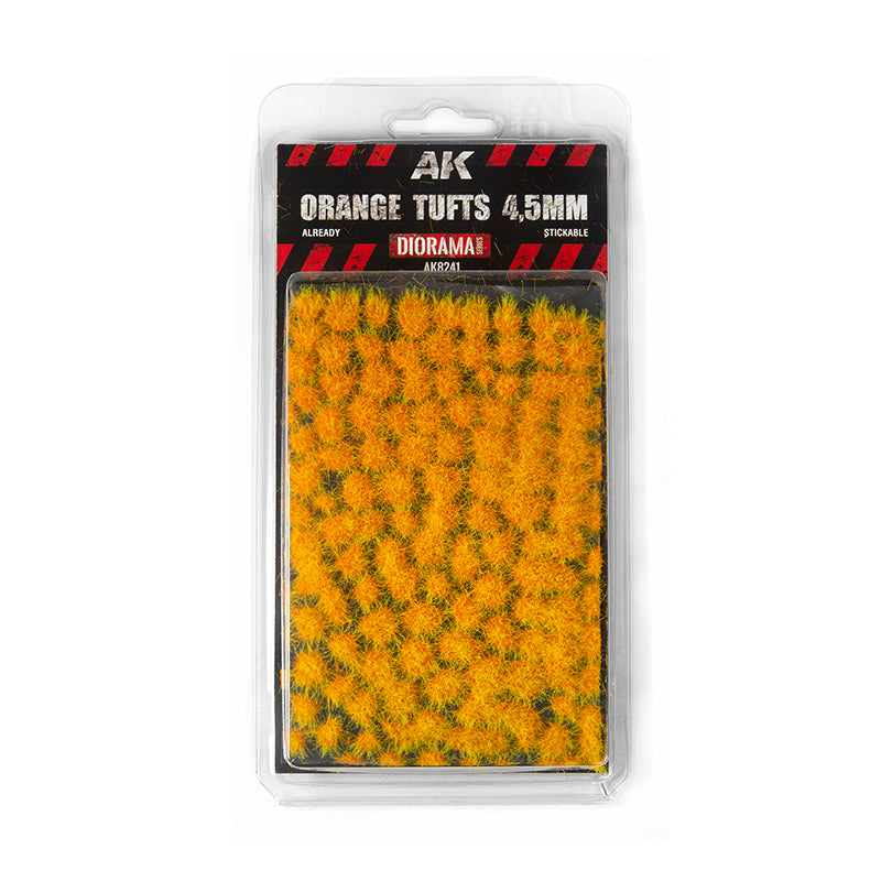 Small -  fuzzy -  stickable model grass clumps in a blister pack