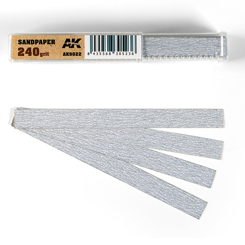 AK 240 grit sandpaper: a clear container with a roll inside, and four gray sanding strips fanned out below it
