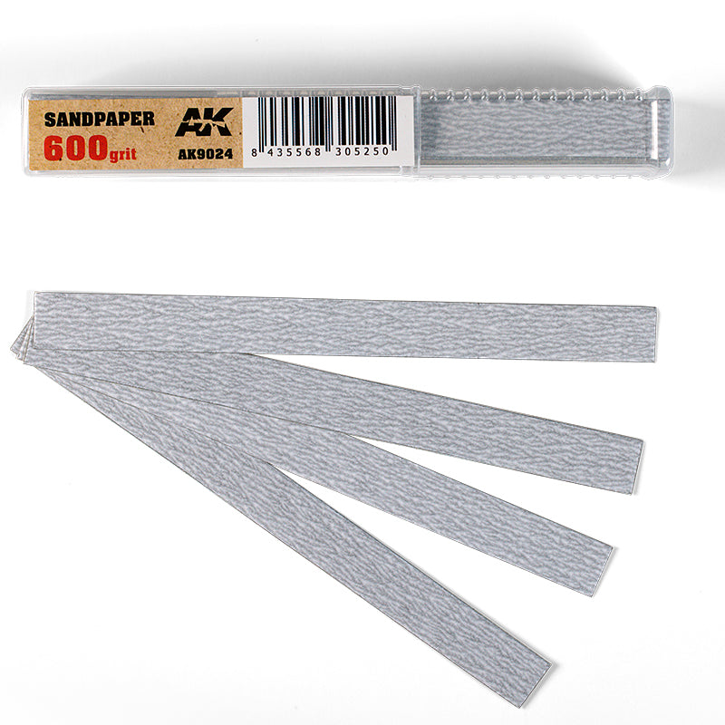 AK brand 600 grit light gray sandpaper strips fanned out next to their clear plastic case