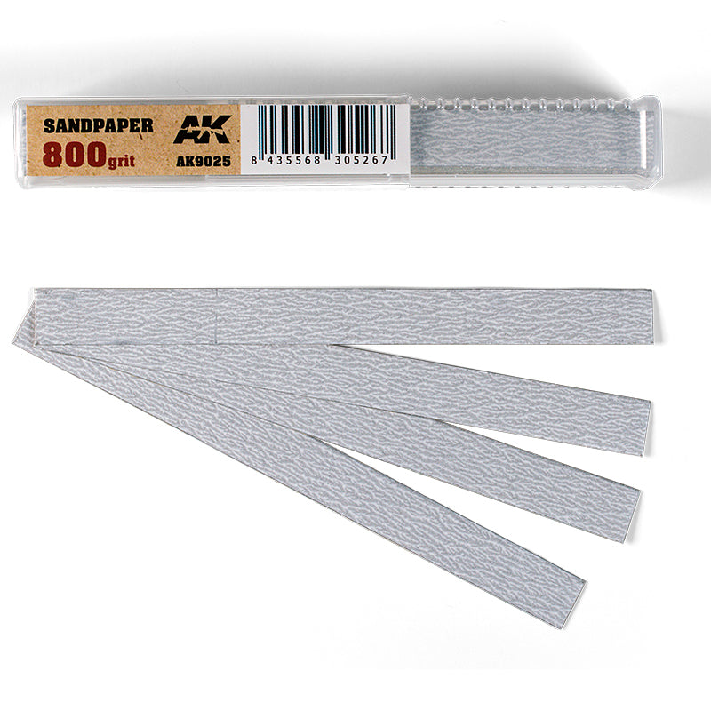 Five light grey 800-grit sandpaper strips fanned out next to their clear plastic package labeled "SANDPAPER"
