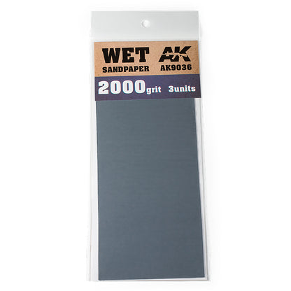 A clear package of Wet AK 2000 grit sandpaper, containing 3 dark gray units