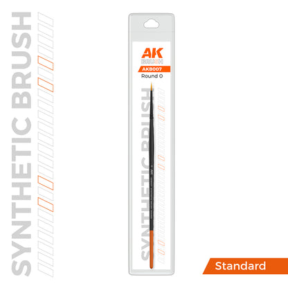 AK BRUSH synthetic Round 0 paint brush in clear retail packaging. It has a black handle, orange tip, and fine, pointed bristles