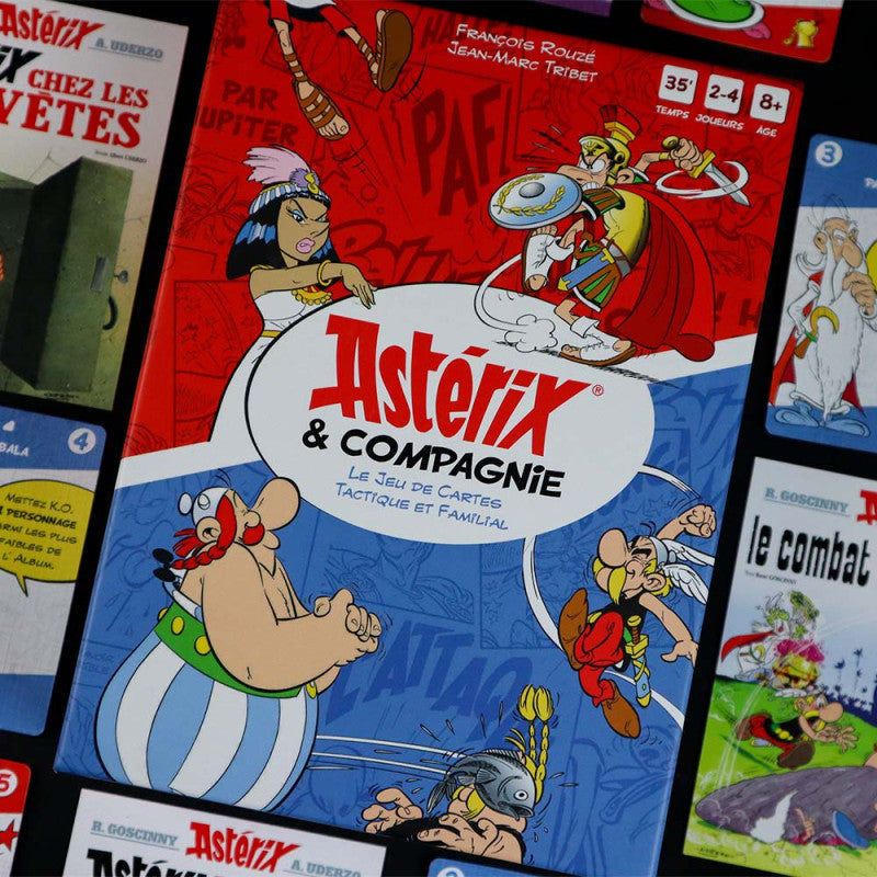 Astérix & Compagnie card game box depicts Asterix, Obelix, a Roman, and other comic characters in action