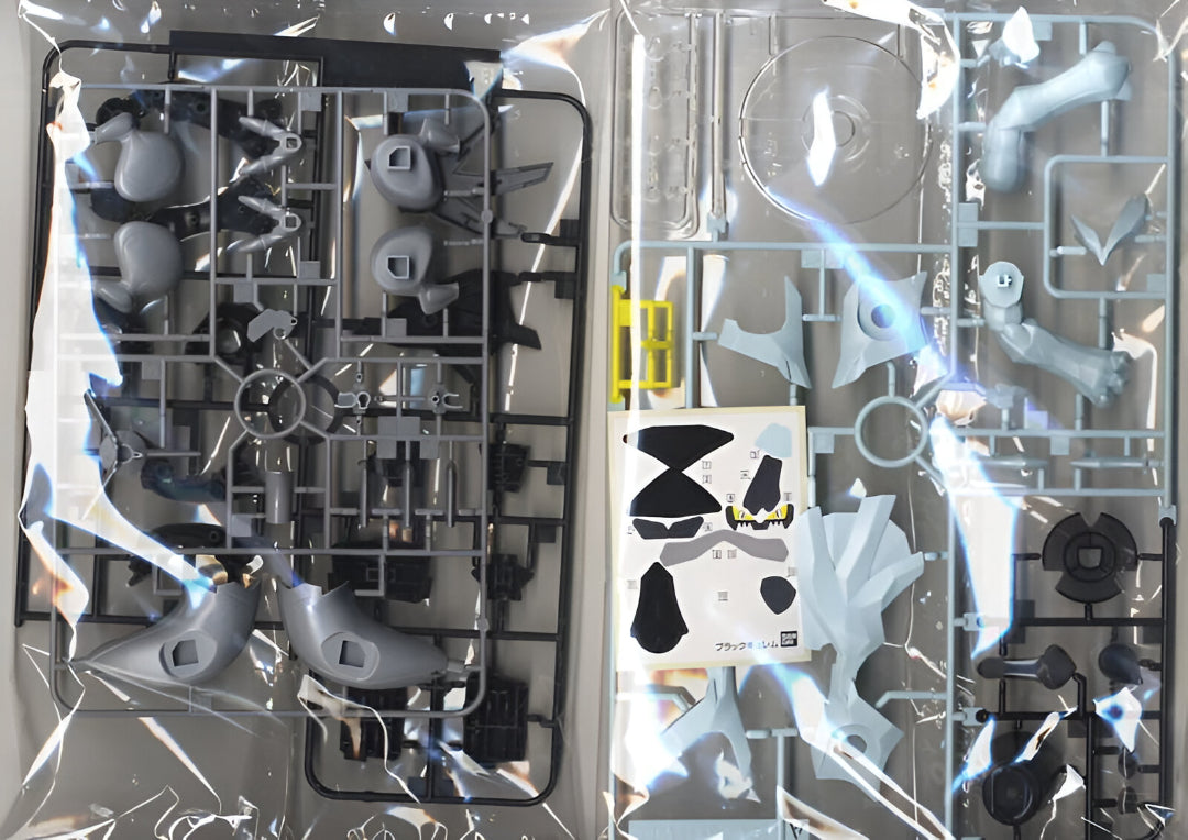 Ice blue and black plastic model kit parts on runners, sealed in clear packaging with decals