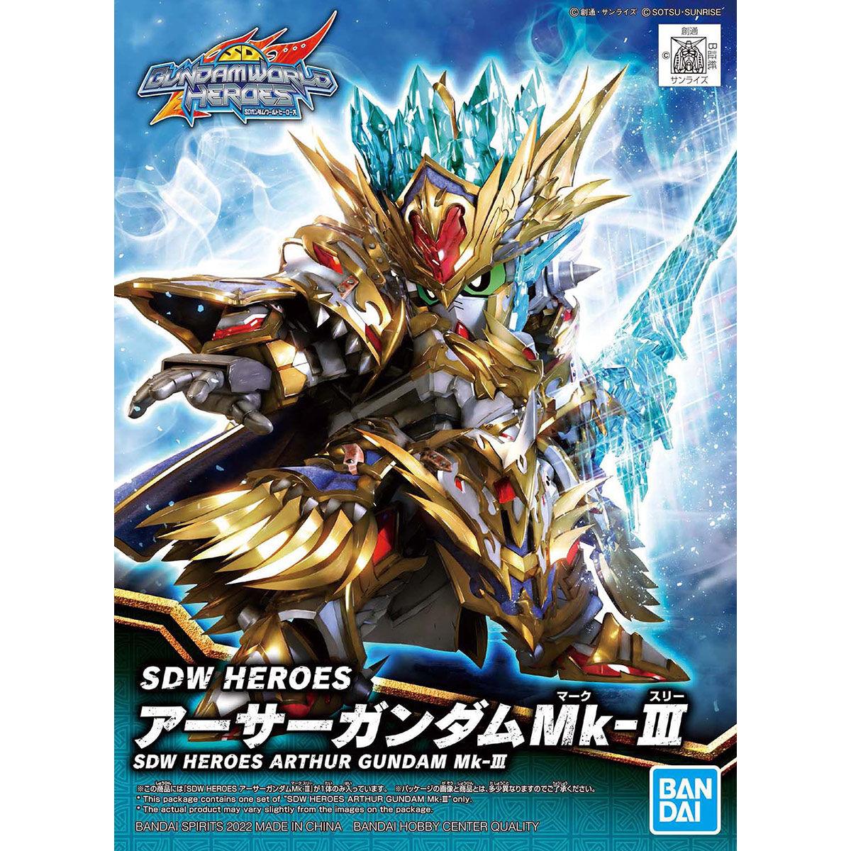 SD Gundam Arthur Mk-III figure in ornate gold armor, posing with a large blue crystal weapon and crown