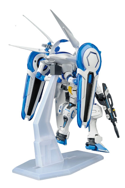 White and blue mecha model kit with large wings and a rifle, posed dynamically on a clear display stand