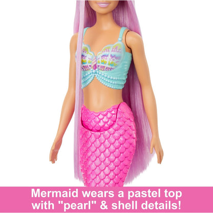 Mermaid doll with long lavender hair -  a pastel blue shell top with pearl details -  and a bright pink scaled tail