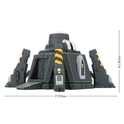 Dark green sci-fi industrial terrain piece: central core, 4 angled supports, yellow/black hazard stripes, skull emblems