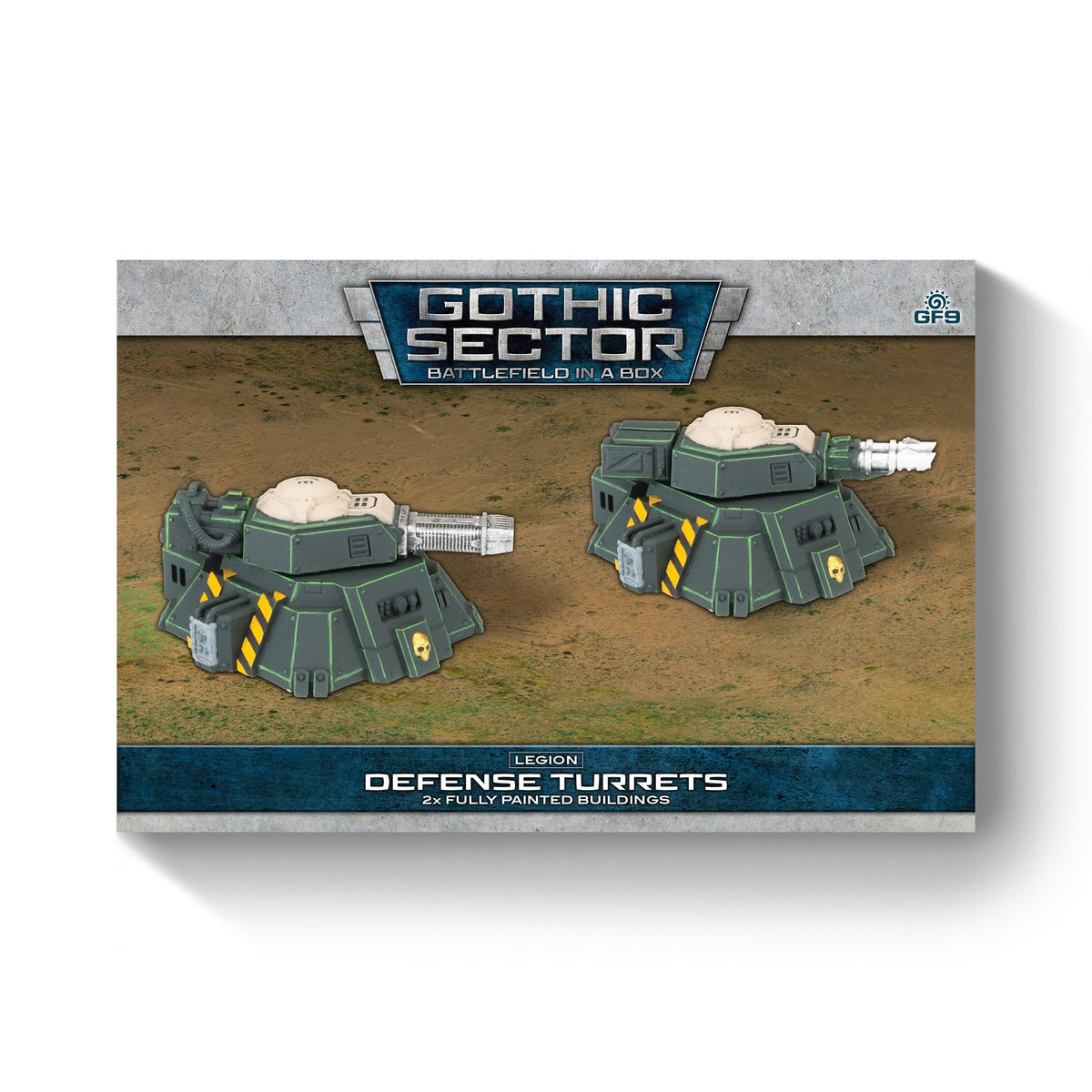 Two fully painted dark green Legion Defense Turrets with large guns, yellow stripes, and skull decals on sandy terrain