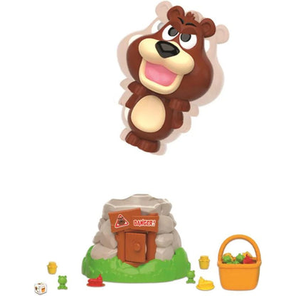 Close-up of Beware of The Bear game components, including the bear in a doghouse, spinner, and colorful plastic bones