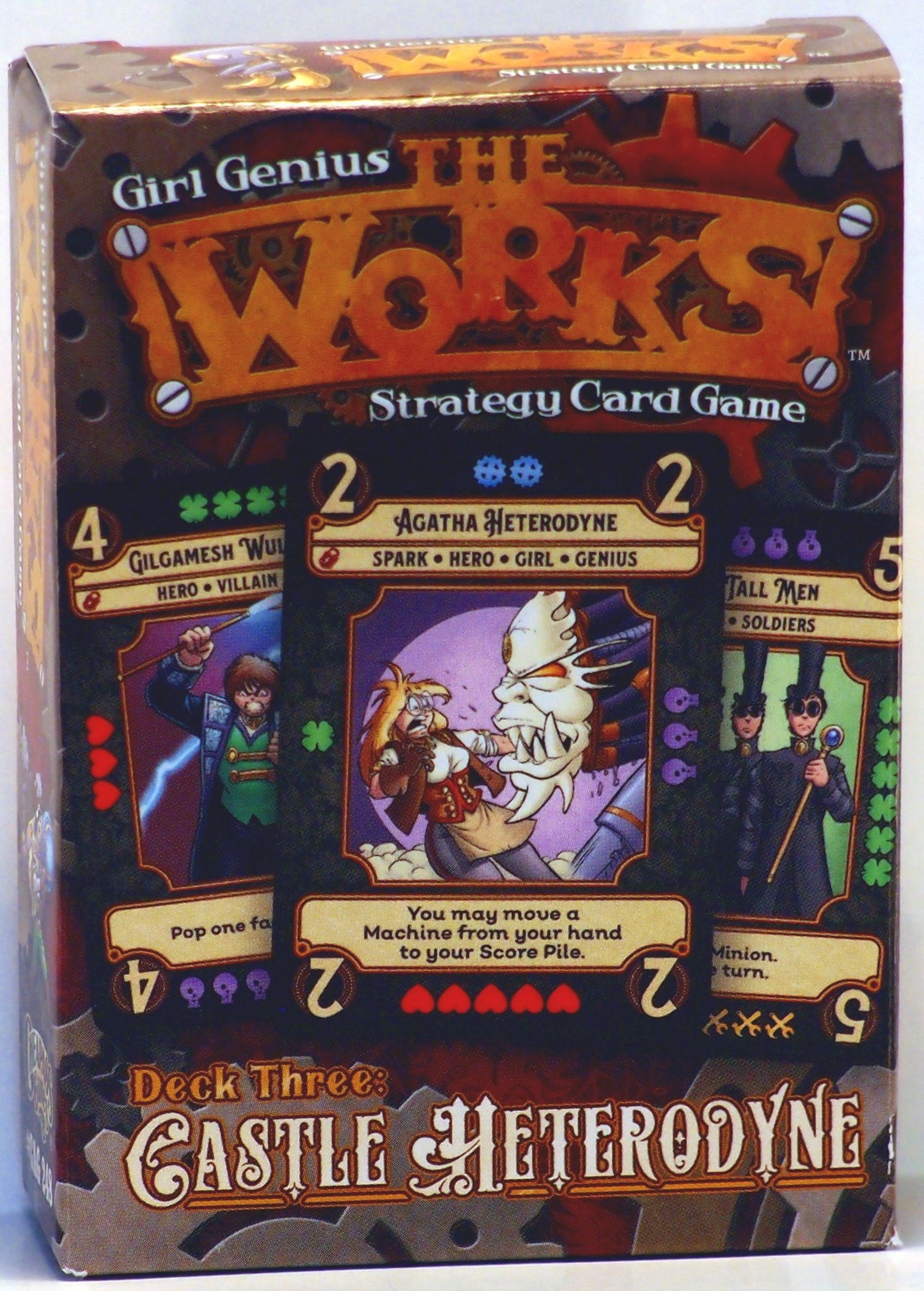 Box for "Girl Genius THE WORKS!" strategy card game (Deck Three: Castle Heterodyne), showing Agatha Heterodyne fighting a monster