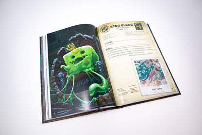 Open book displaying "King Blrrk Big Bad Bureau Case File," left page has an illustration of a green, slimy, cheese-like monster with a crown on a throne