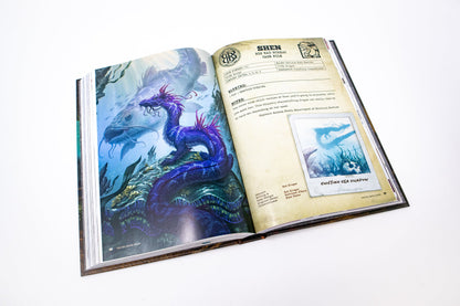 Open book displaying a vibrant purple sea dragon in an underwater illustration on the left, and a "SHEN Big Bad Bureau Case File" with text and a polaroid image on the right
