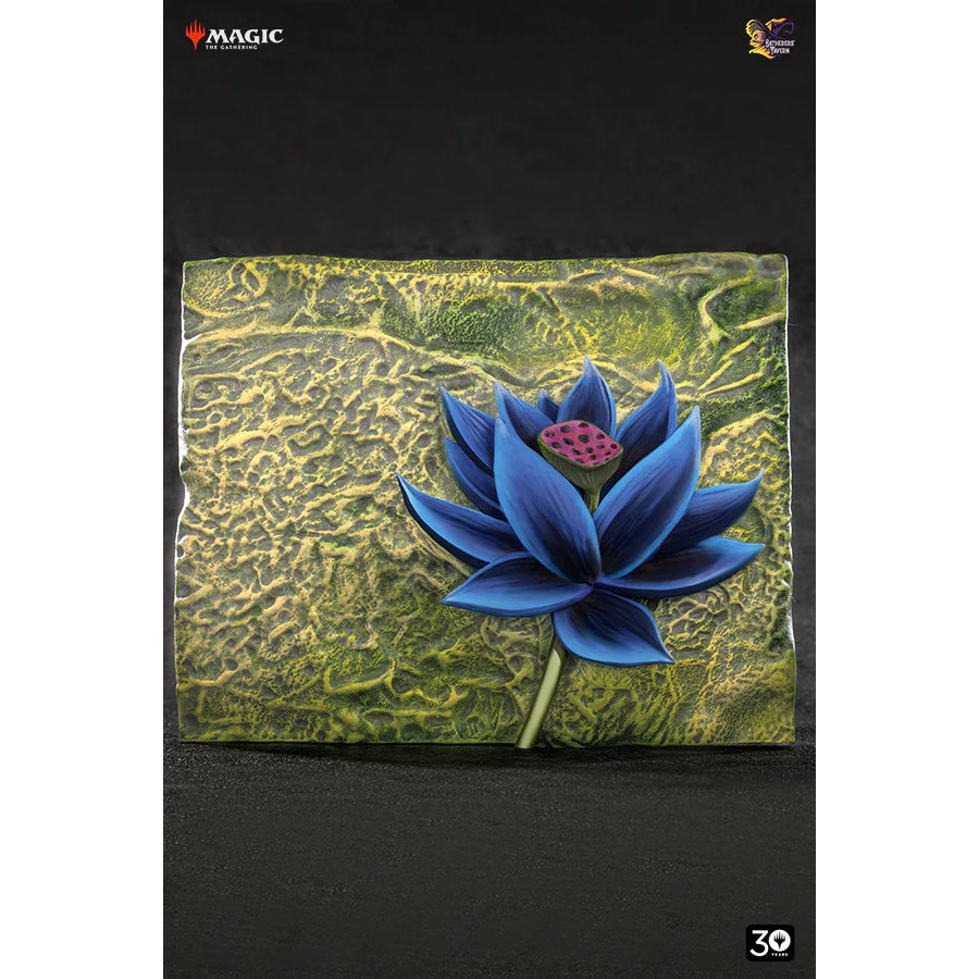 Sculpted Magic: The Gathering Black Lotus, a blue-black flower with a pink seed pod on a textured green-gold plaque