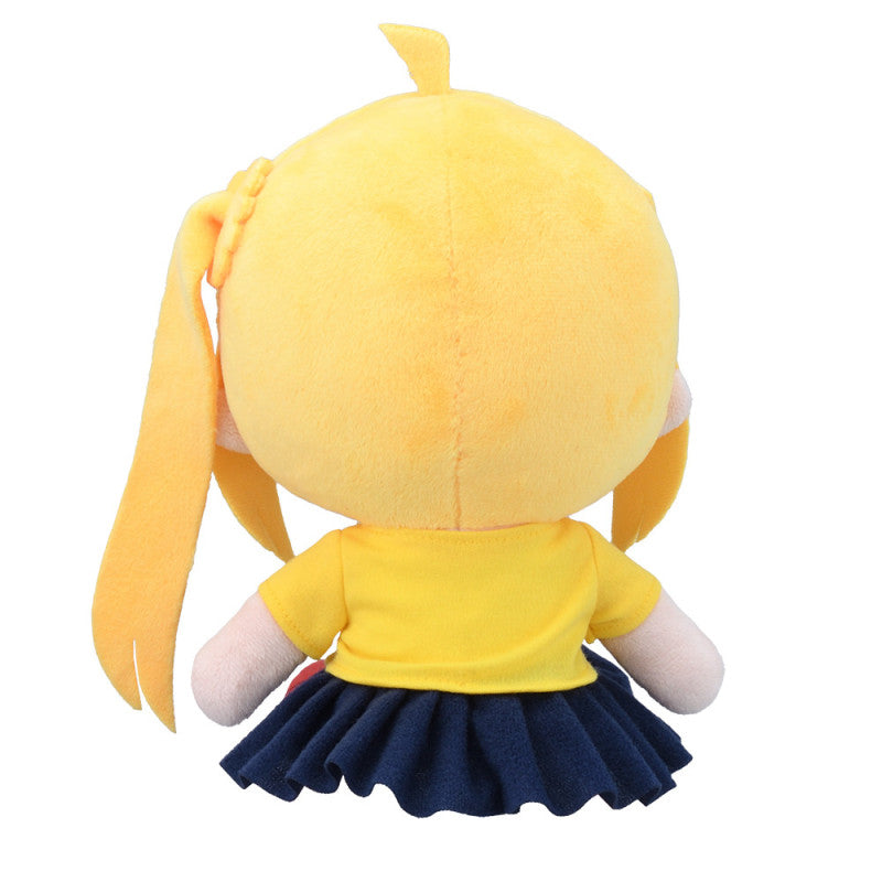 Back view of yellow plush doll with short bangs and a long ponytail