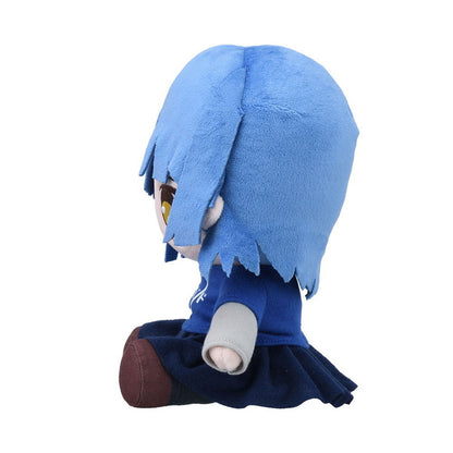 Blue-haired anime character plush doll wearing a navy sweater and skirt sitting with legs extended