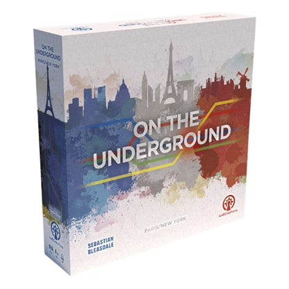 Board game box for "On the Underground: Paris/New York" with city skylines and colourful subway lines.
