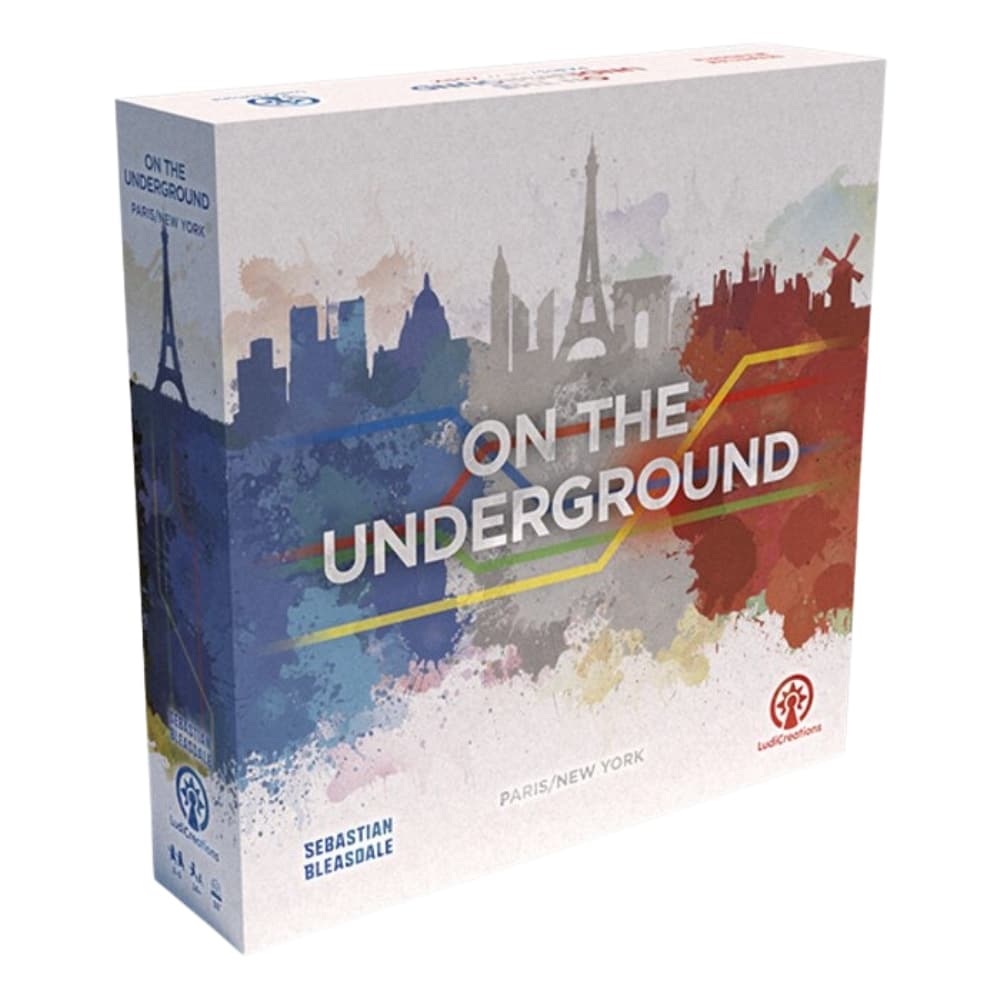 Board game box for &quot;On the Underground: Paris/New York&quot; with city skylines and colourful subway lines.
